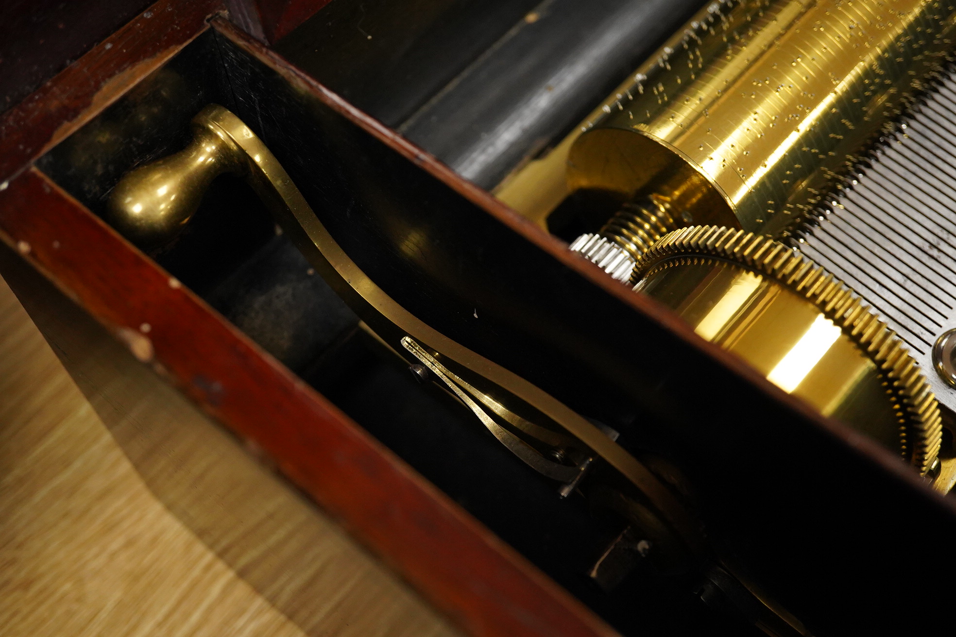 A late 19th century inlaid and ebonised rosewood Swiss cylinder music box by Nicole Freres, Geneve, and retailed by Alfred Hays, 4, Royal Exchange Buildings, complete with all teeth to the comb, cylinder 27.8cm long, the